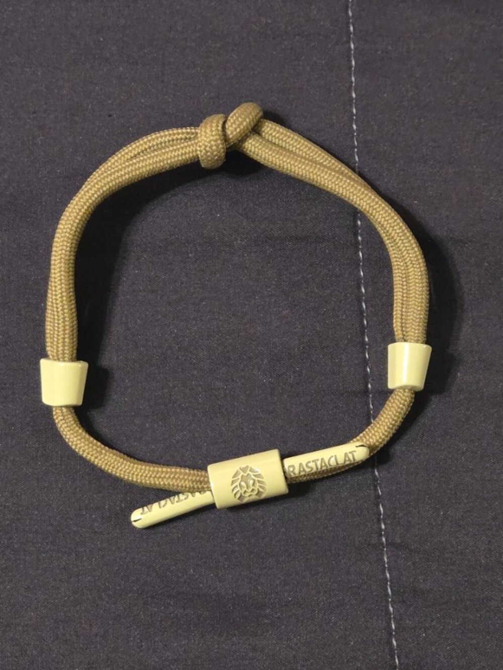 RASTACLAT KNOTTED SHOELACE BRAIDED PULL TO CLOSE BRACELET.